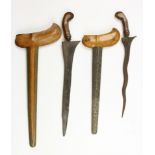 Three Javanse keris, a Madura keris and a straight Balinese keris.