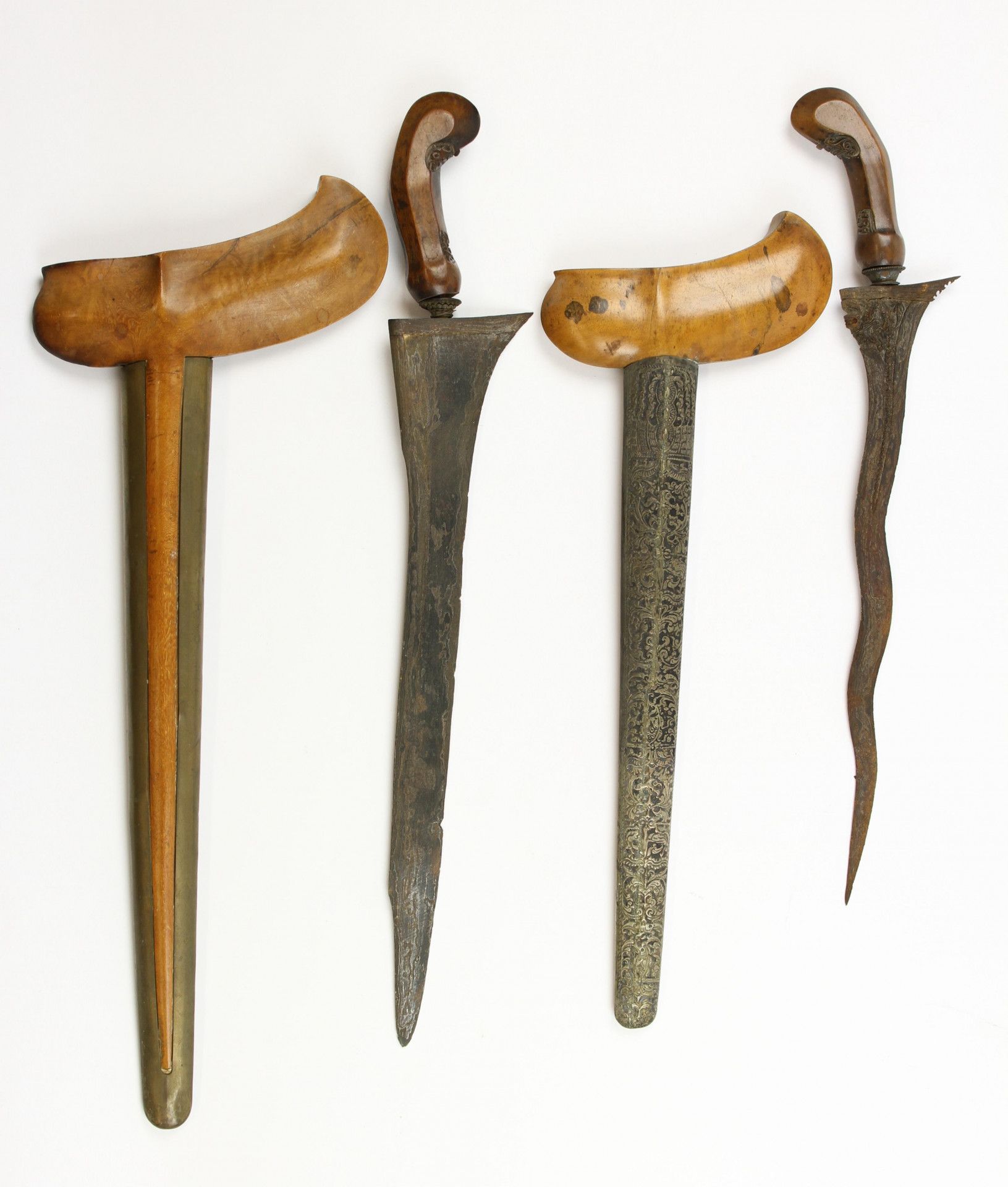 Three Javanse keris, a Madura keris and a straight Balinese keris.