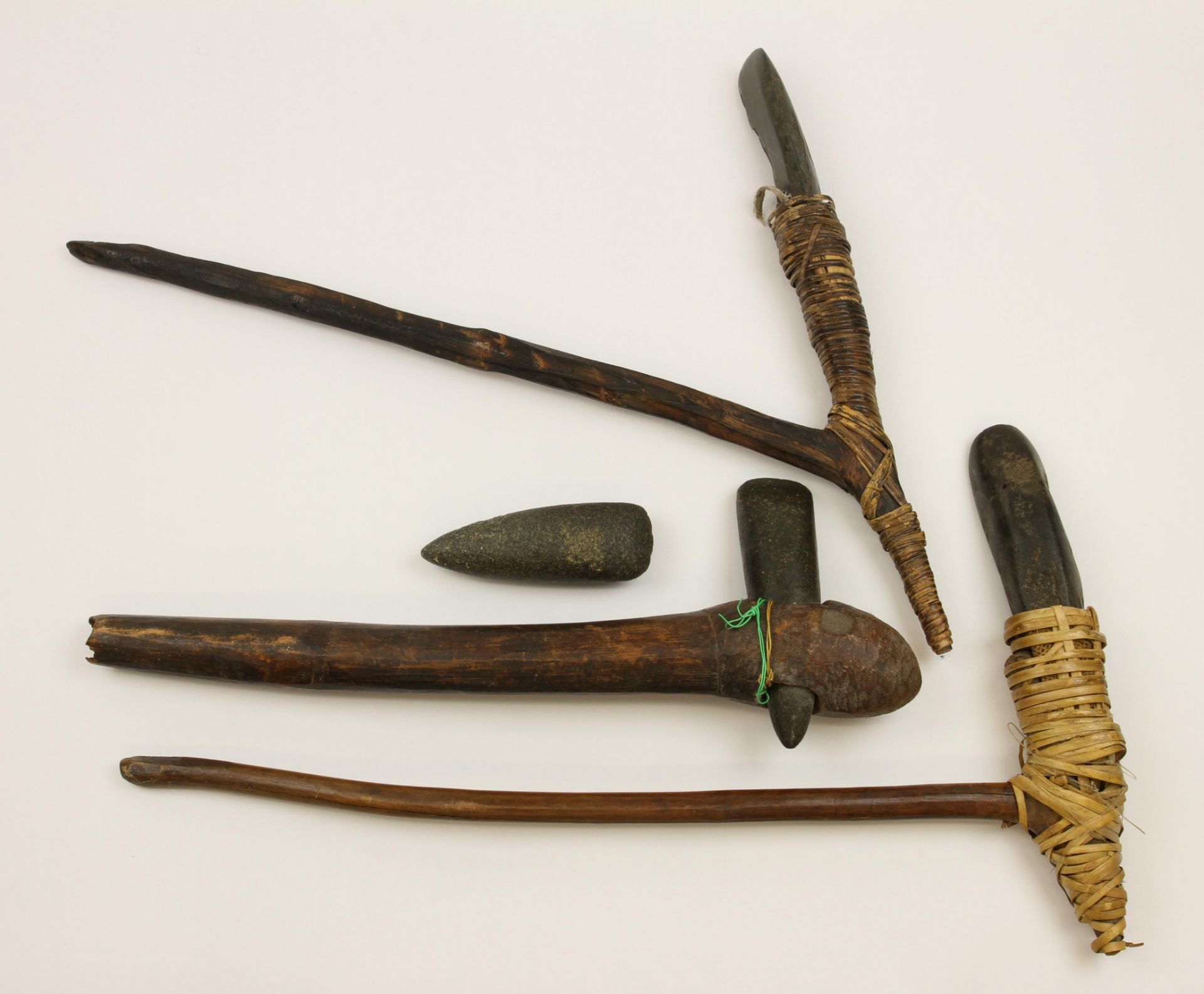 Papua, Asmat, two adzes and an axe
