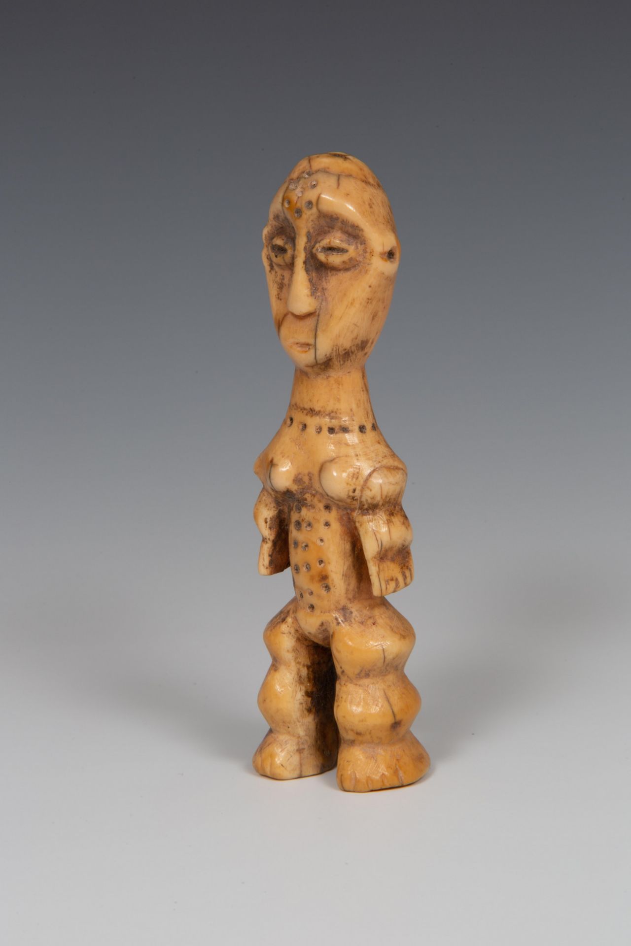 DRC., Lega, standing ivory figure.
