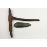 Papua, an axe with wooden and pyrochraphed handle and a wooden adz,