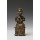 Cameroon, Grass lands, seated figure on a throne with buffalo heads