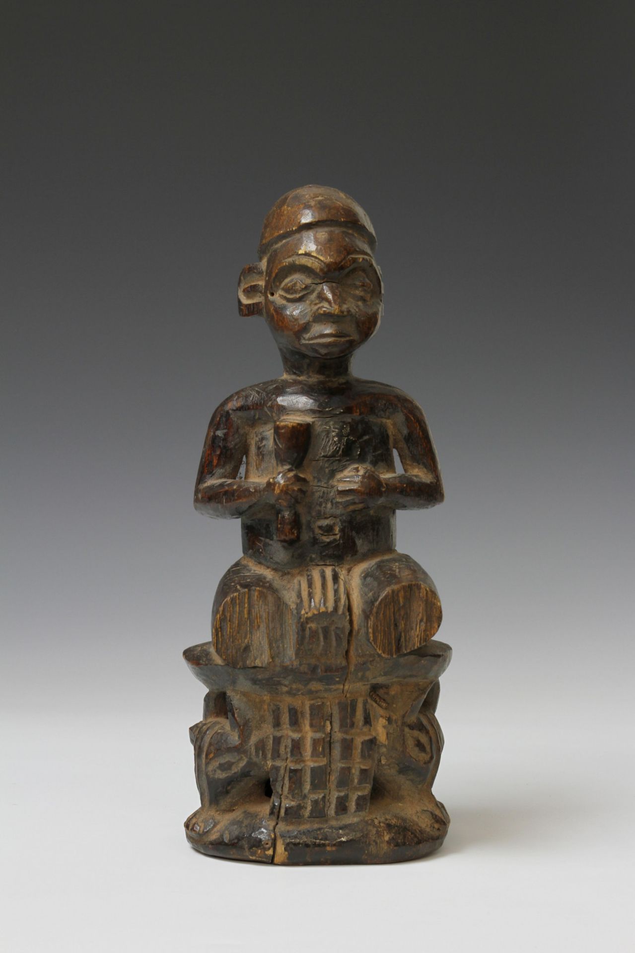 Cameroon, Grass lands, seated figure on a throne with buffalo heads