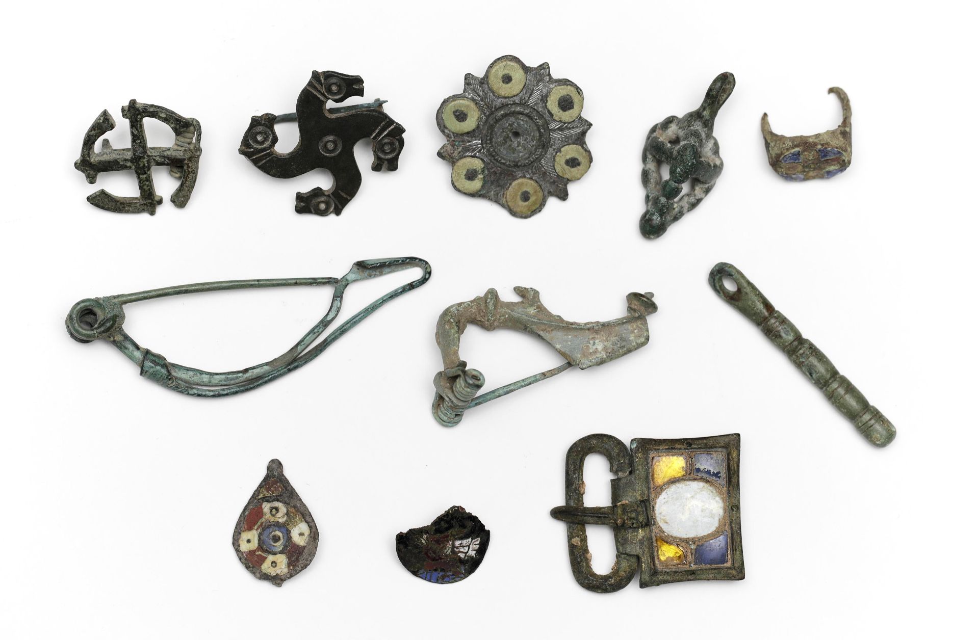 A collection of ten bronze fibula and a ring, Roman Period and later date.