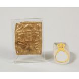 A golden applique, possibly Mesapotamian and a golden antique ring.