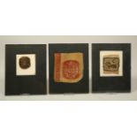 Egypt, a collection of three textile fragments, depicting a lion, and two floral panels.