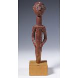 Togo, Ewe, finial shaped as a male figure, red pigment,