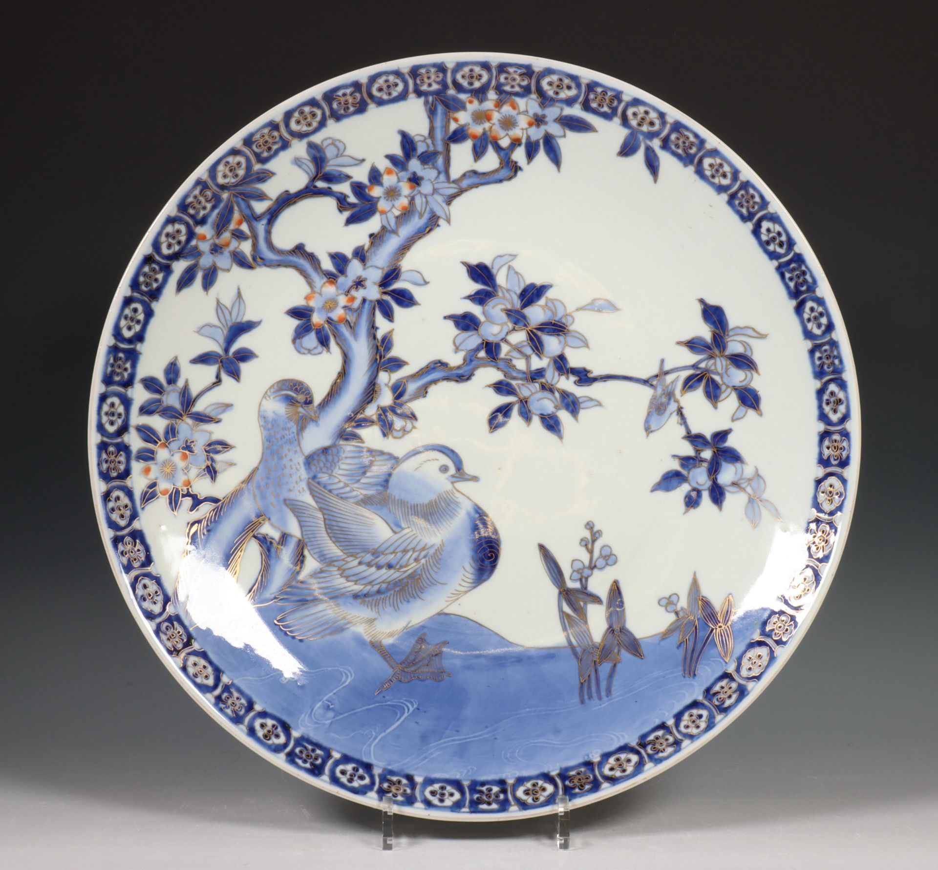 Japan, blue and white and gilt porcelain dish, Meiji period, decorated with ducks below a blossoming
