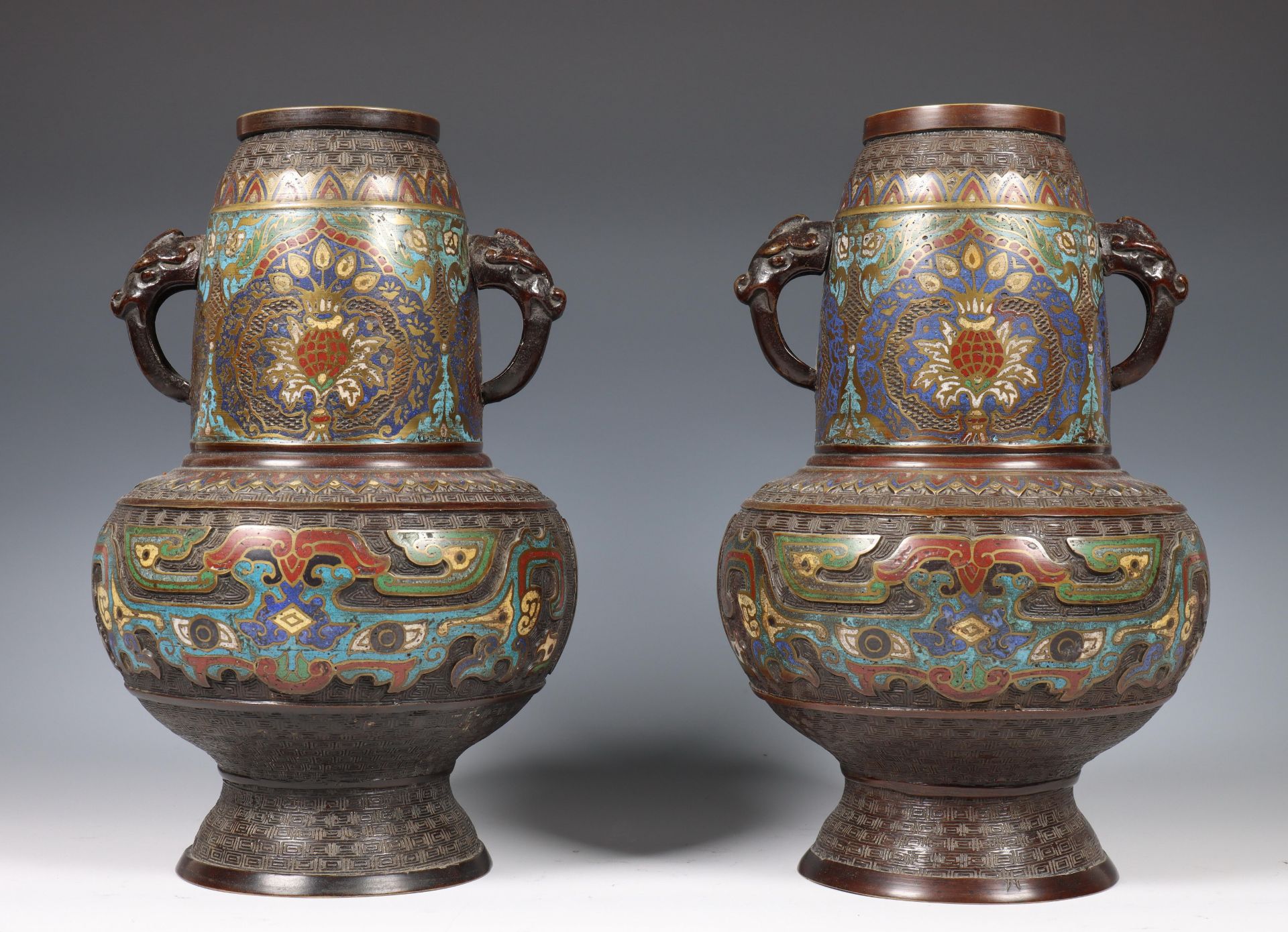 China, pair of bronze cloisonné vases, early 20th century, both with elephant-head handles