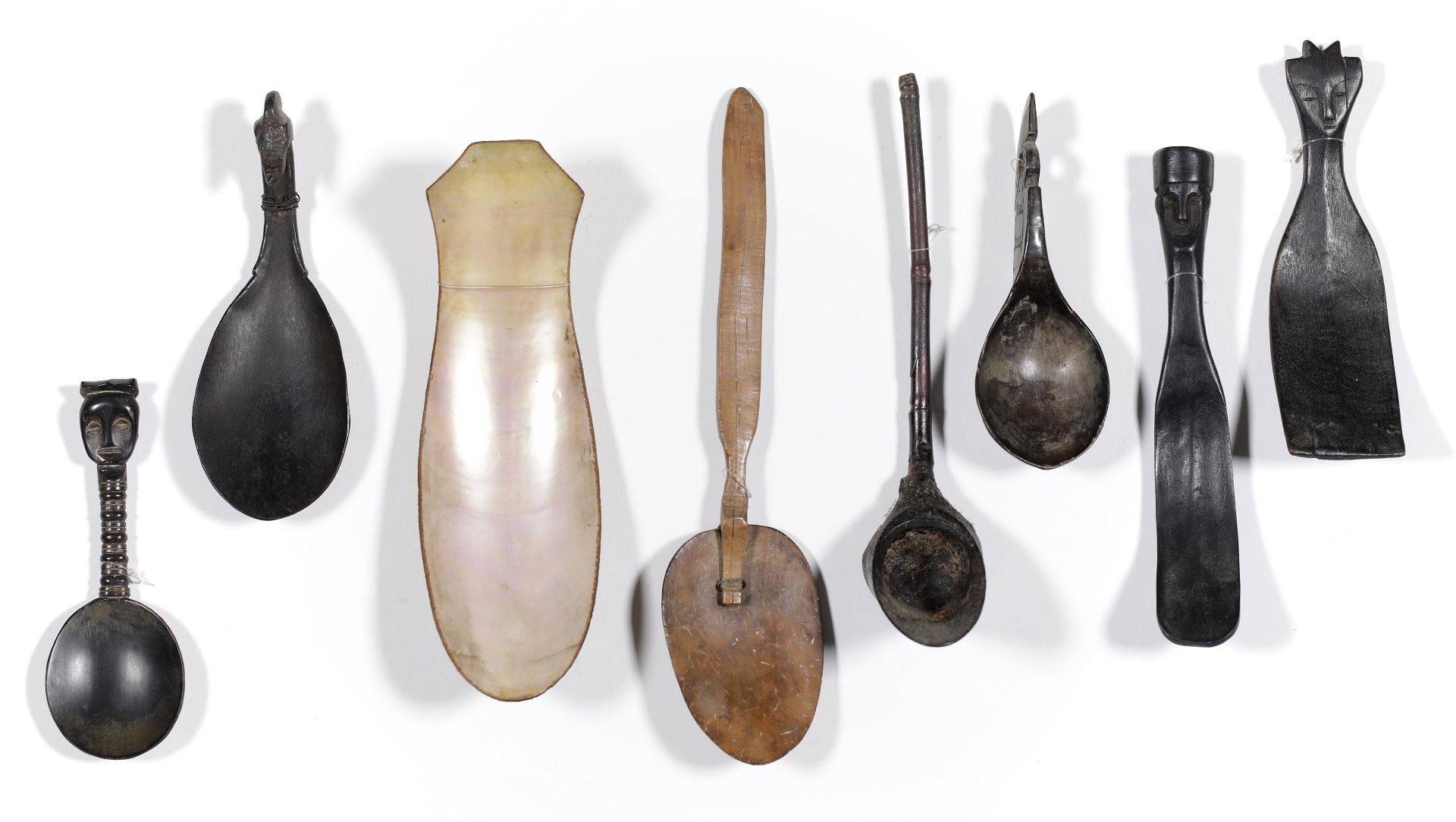 Indonesia, a collection of eight various spoons made of horn, shell and wood