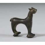 An antique bronze figure of a cat.