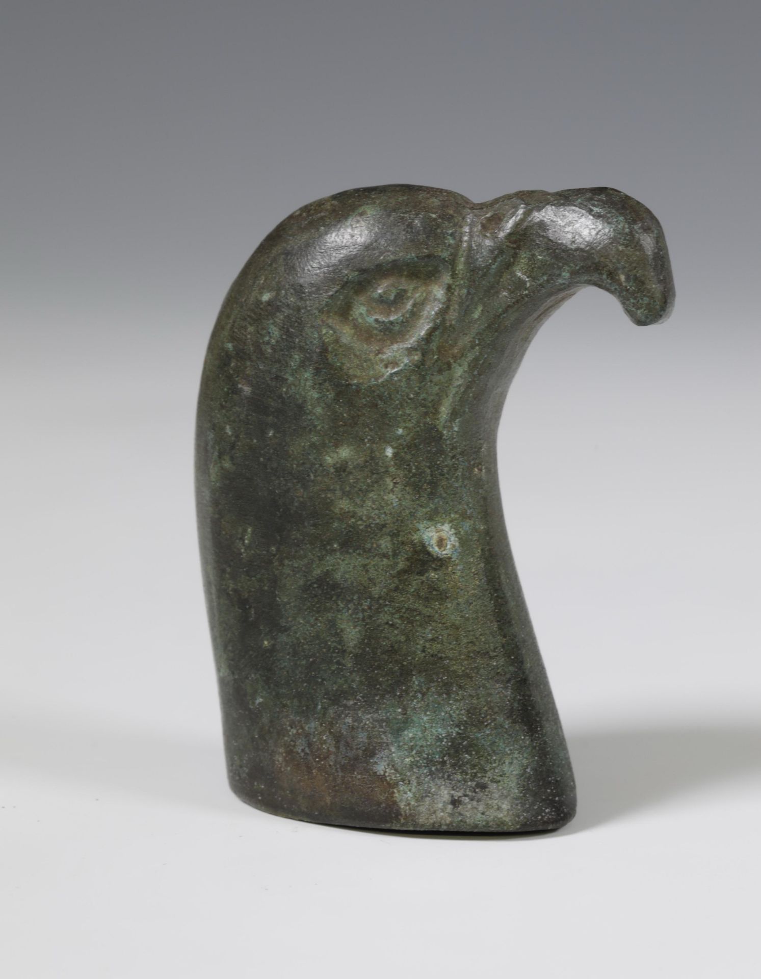 Roman bronze head of a falcon, and a collection of nine Roman bronze human- and animal heads, ca. 1s - Image 4 of 4