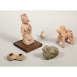 Antique terracotta horse figure, two terracotta pots and a possibly antique stone carved animal figu