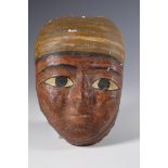 Egypt, a stucco canvas mummy mask, Ptolomeic Period.