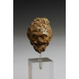 A Greek terracotta fine head of a Satyr, ca. 4th century BC.