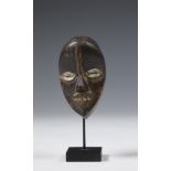 Ivory Coast, Dan, miniature mask with aluminium eyes and teeth