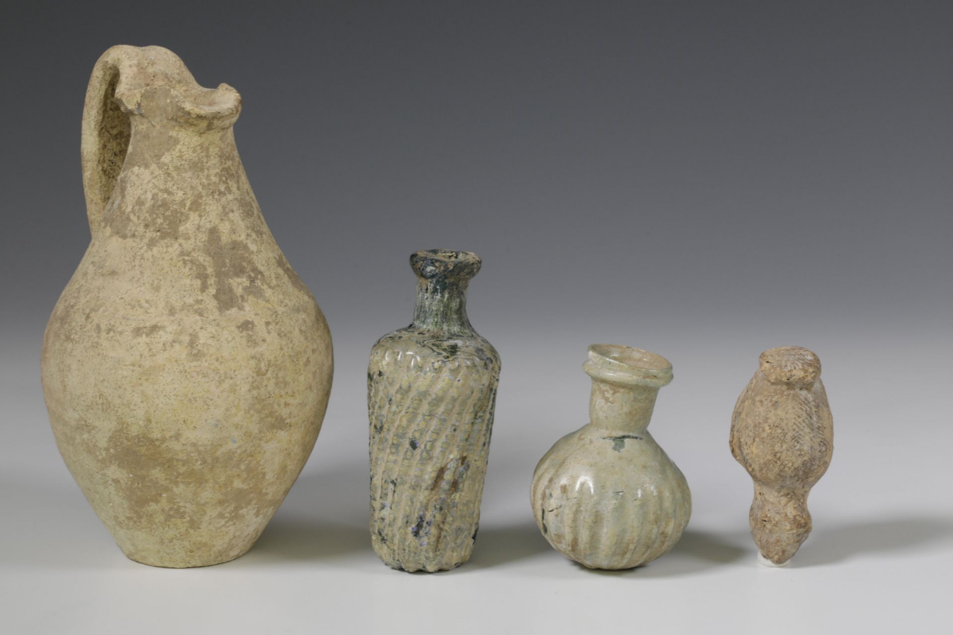 Two Roman glass bottles and a terracotta flask, 2nd-3rd century. - Image 3 of 3