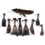 Sulawesi, Toraja, eight various wooden spoons; herewith an Ambon clove boat with three rowers