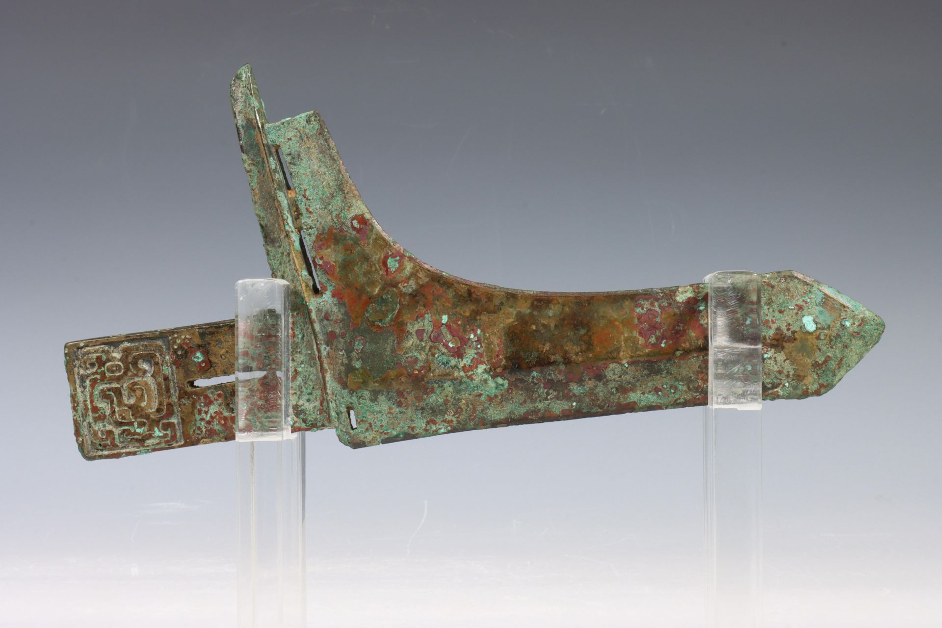 China, bronze axe, probably Eastern Zhou dynasty, the rectangular handle cast with stylised