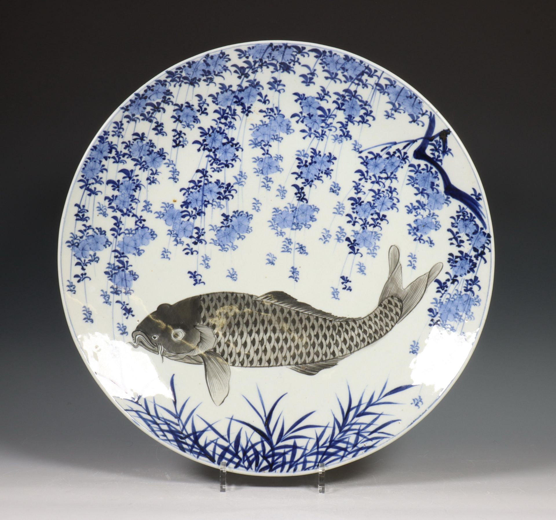 Japan, two blue and white porcelain dishes, 19th-20th century, one decorated in grey with a carp