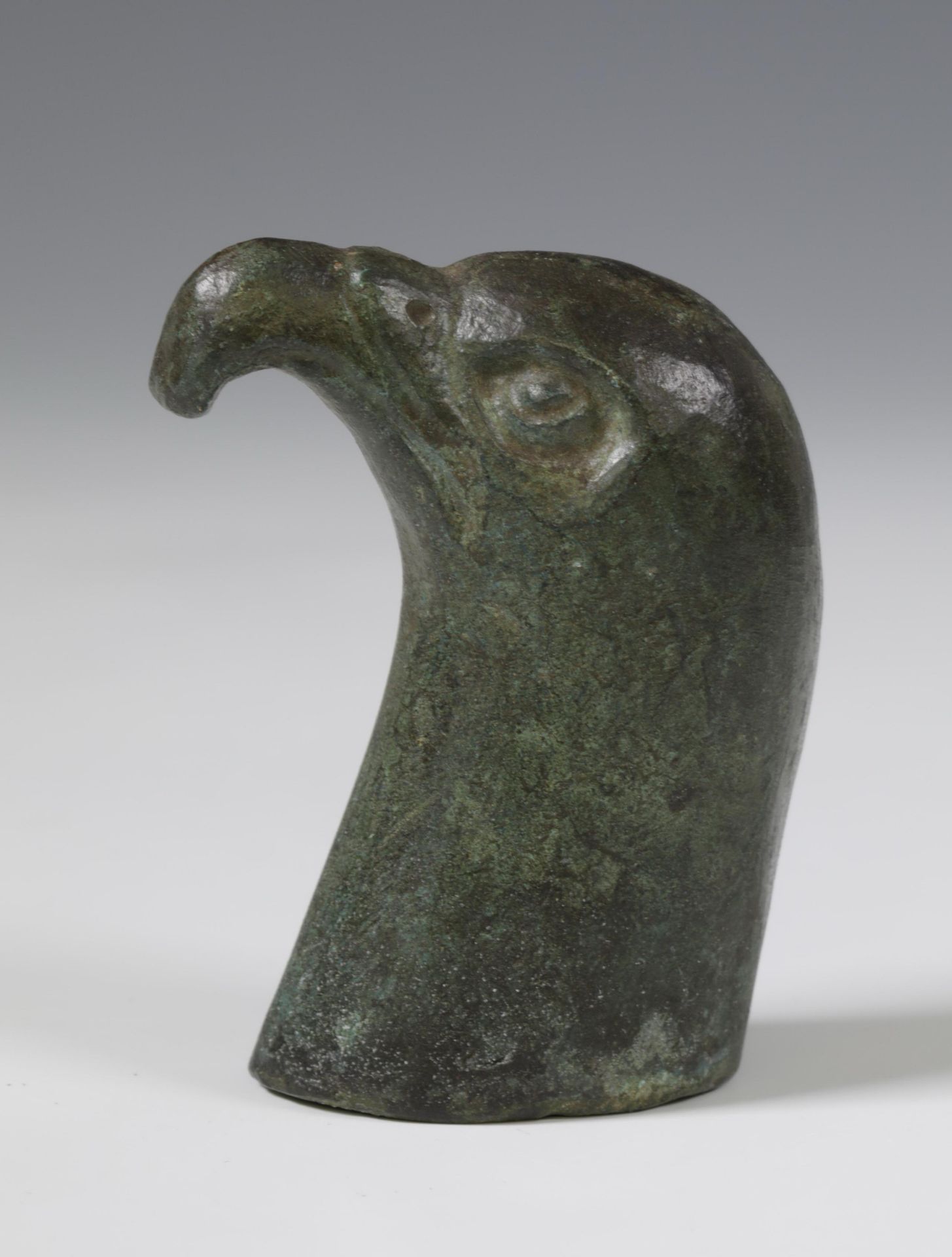 Roman bronze head of a falcon, and a collection of nine Roman bronze human- and animal heads, ca. 1s - Image 2 of 4