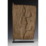 Mali, weathered wooden granary door with a reptile in relief