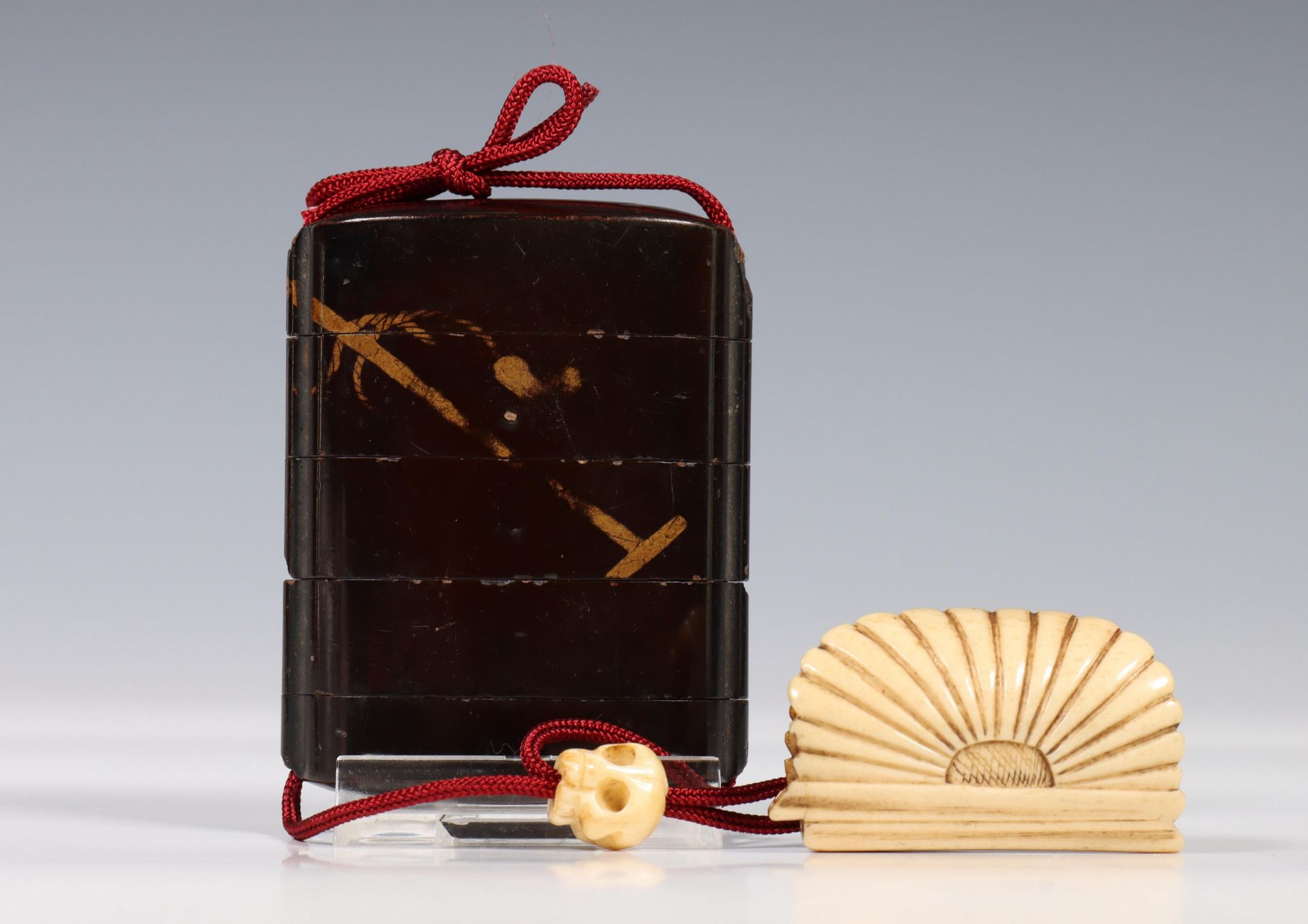 Japan, black lacquer inro with ivory netsuke and ojime, late 19th century, deccrated in gold, with