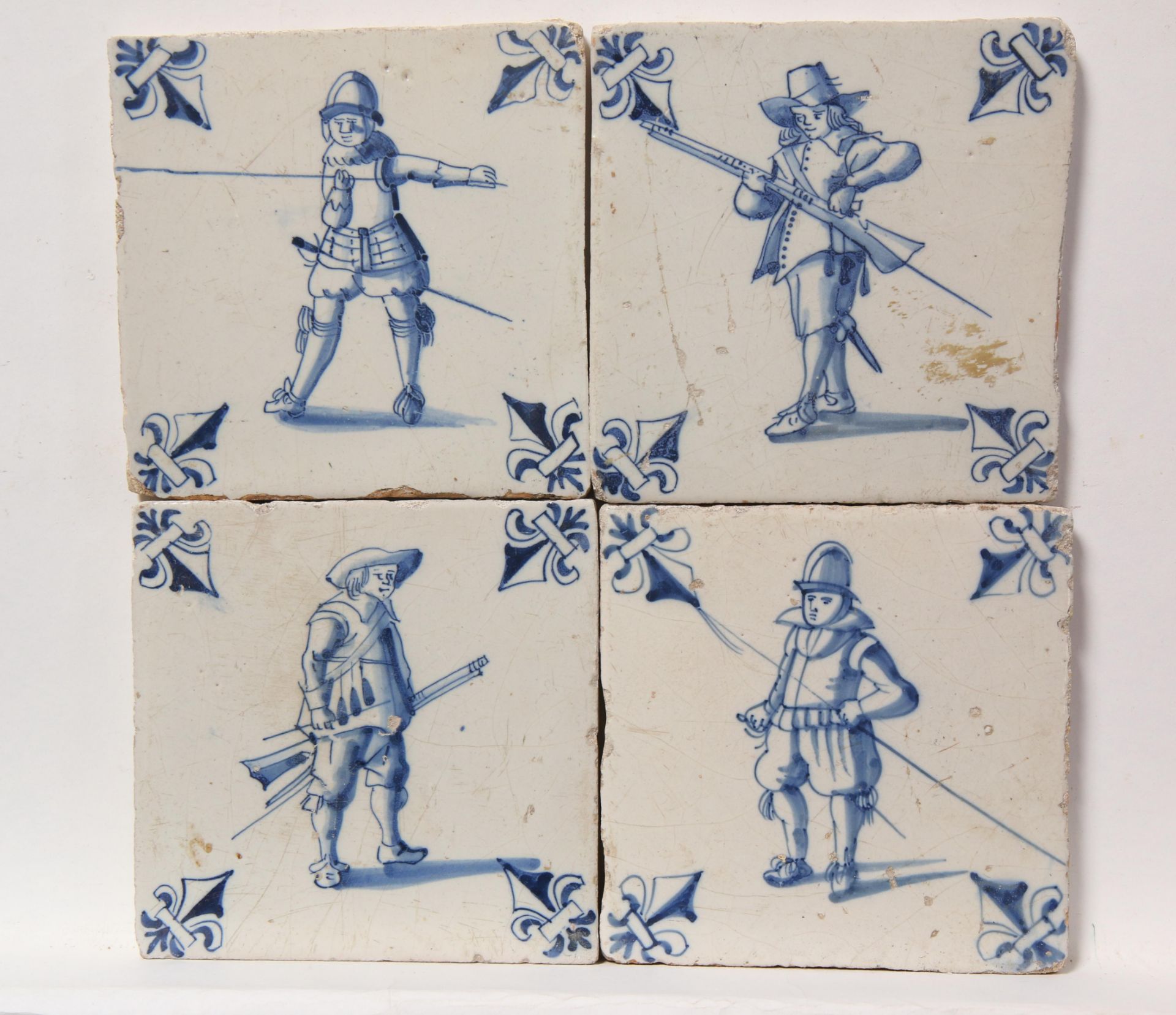 Vier blauw aardewerk figuurdecor tegels, ca. 1620 - 1650.