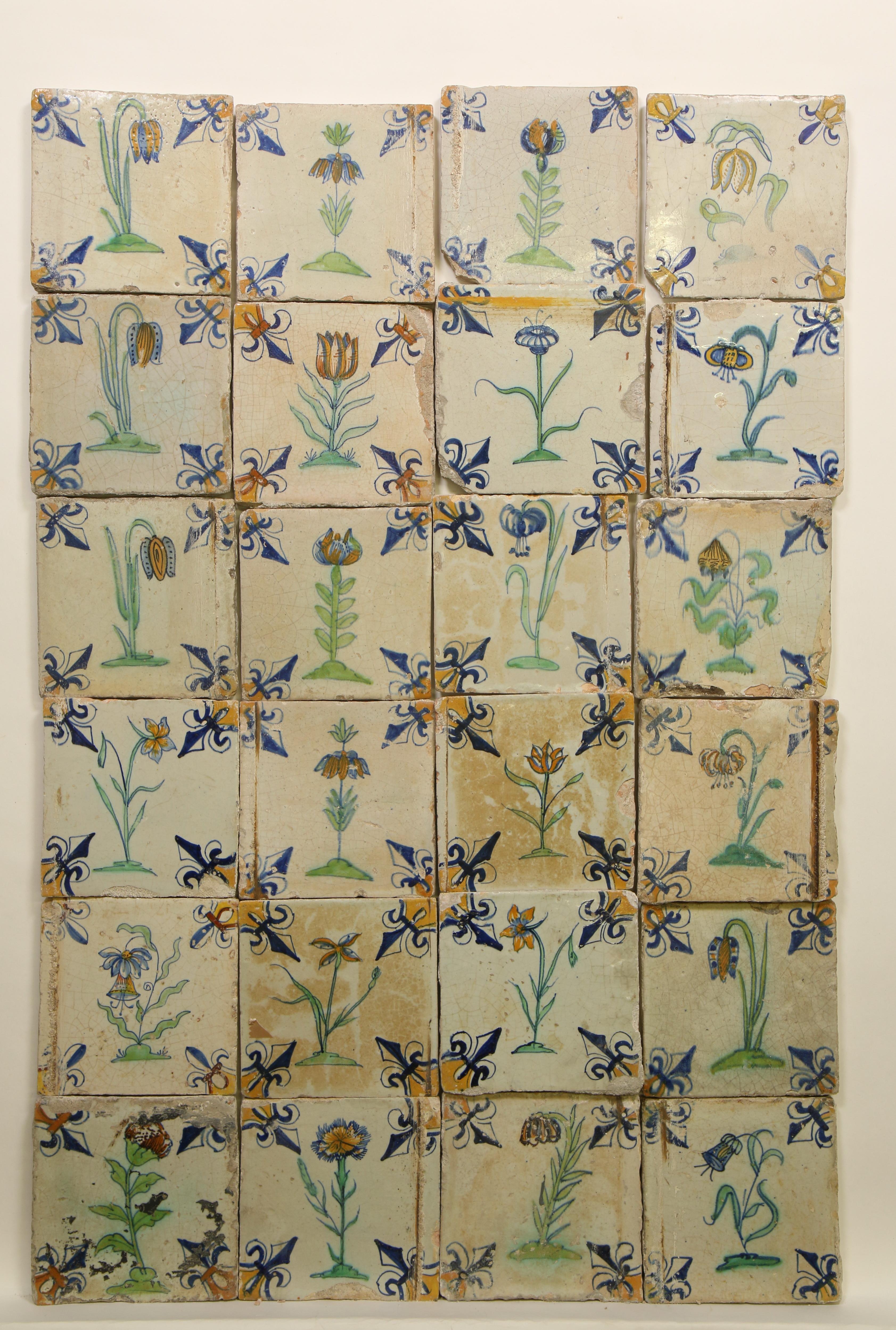 Vierentwintig polychroom aardewerk bloemendecor tegels, ca. 1620 - 1650;