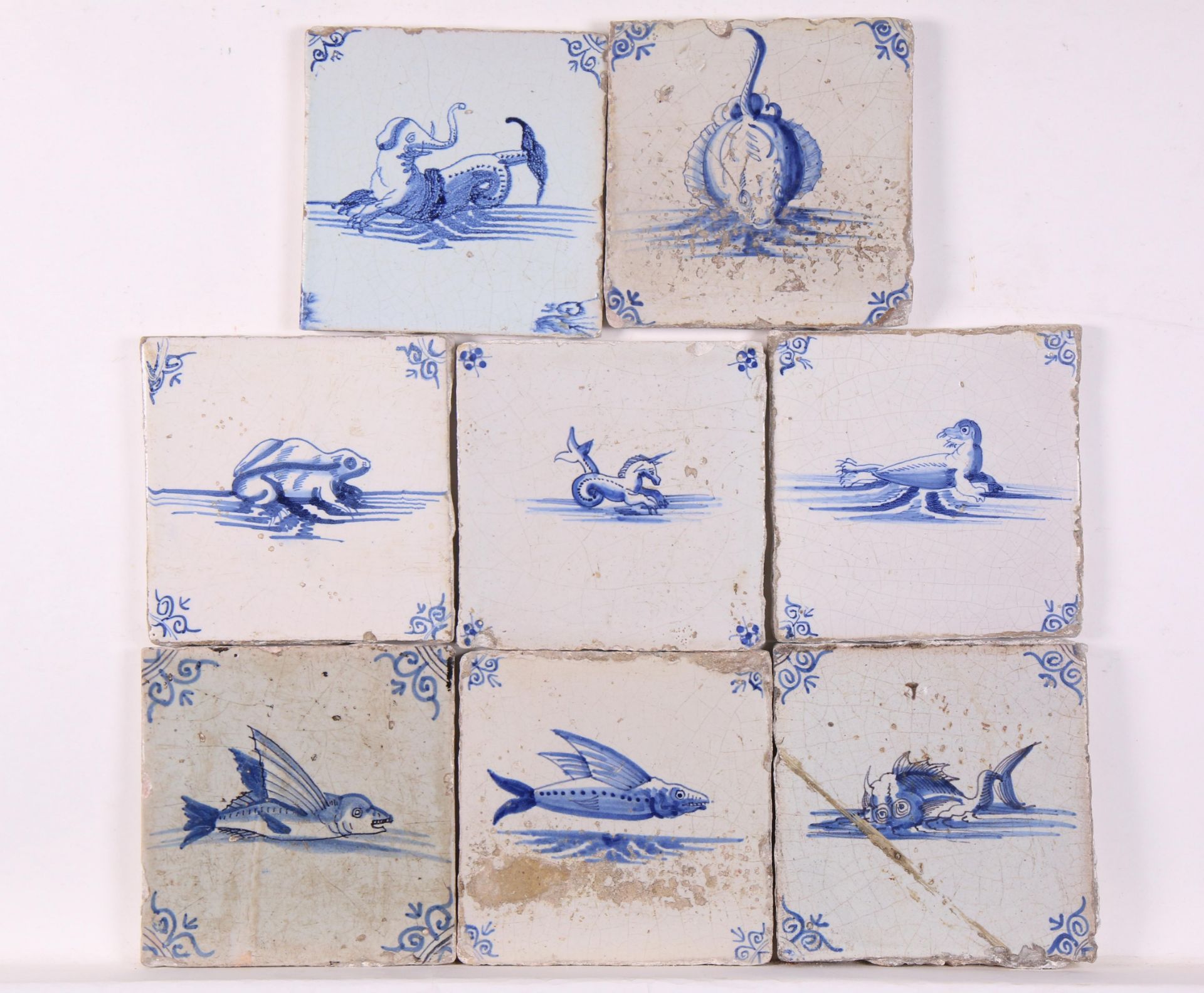Acht blauw aardewerk dierdecor tegels, 1630-1650,