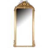 19th century mirror in a richly decorated wooden frame