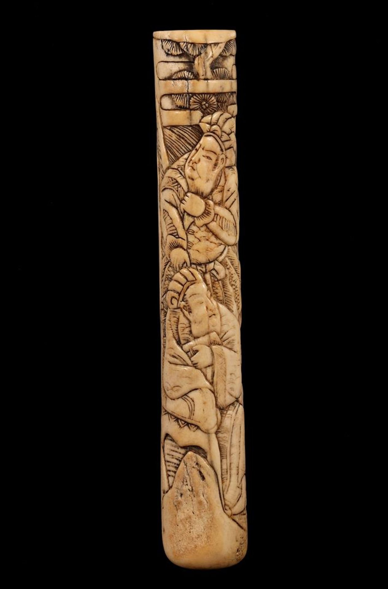 Richly carved bone handle at the front and parasol