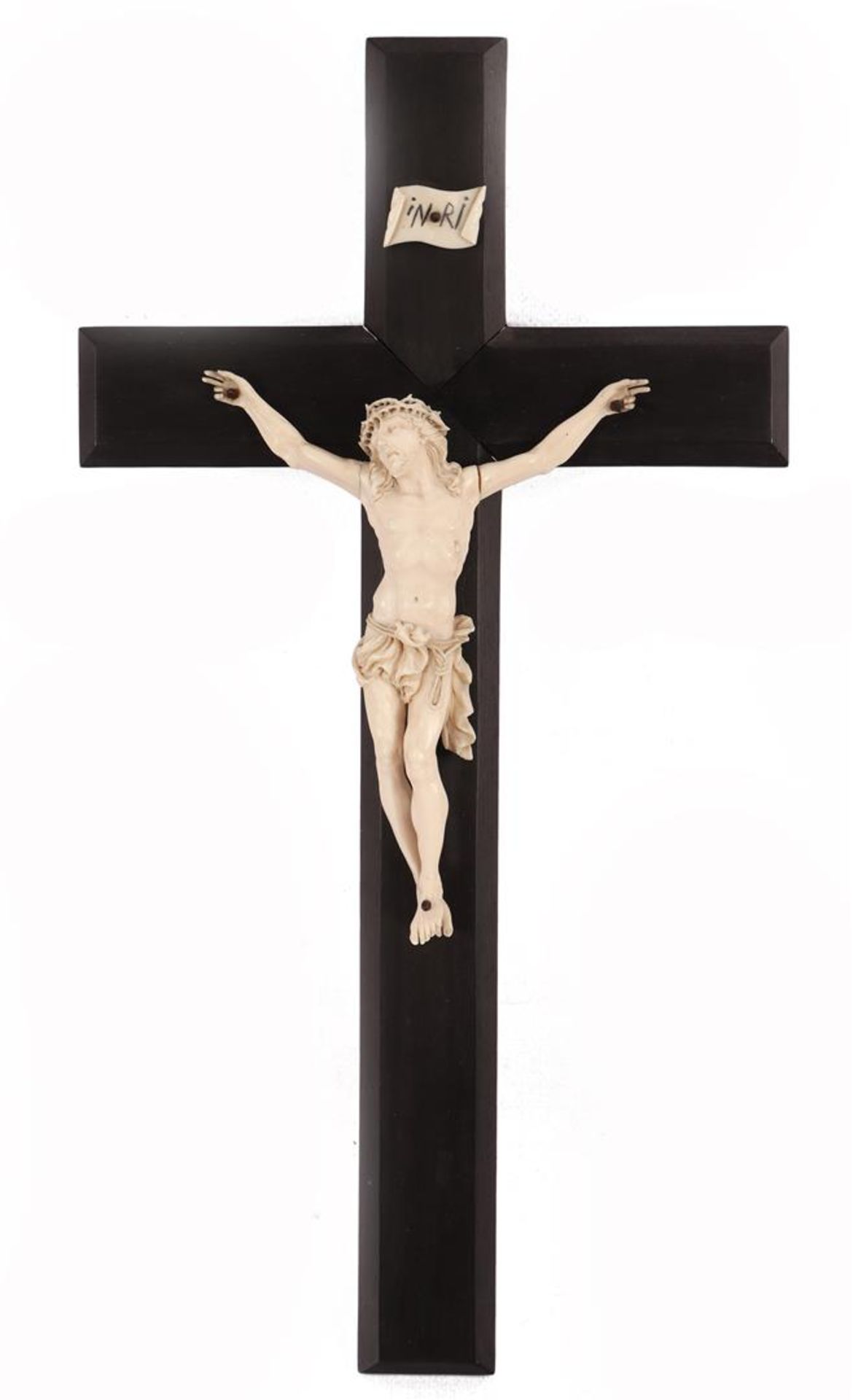 Richly carved ivory Corpus on wooden cross