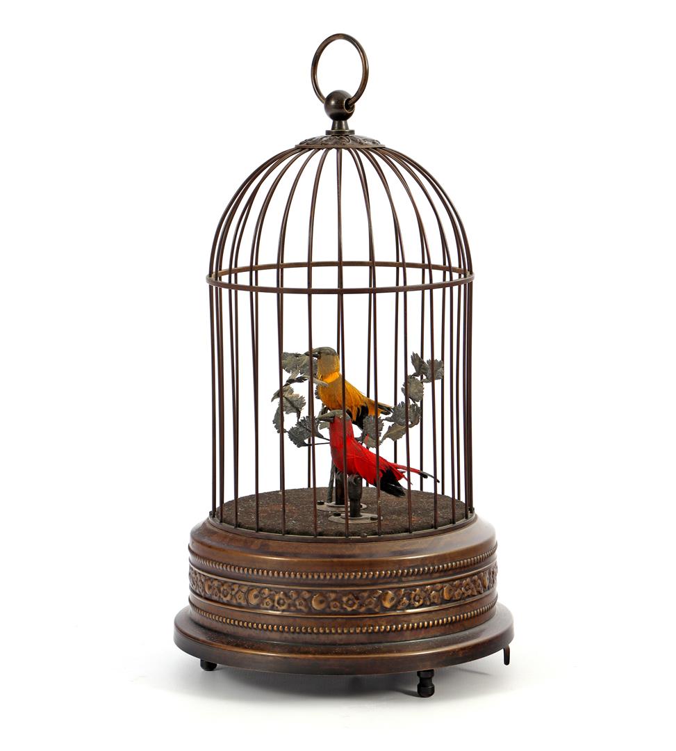 Copper bird cage with imitation birds