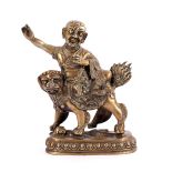 Asian bronze statue of a monk on a fantasy animal