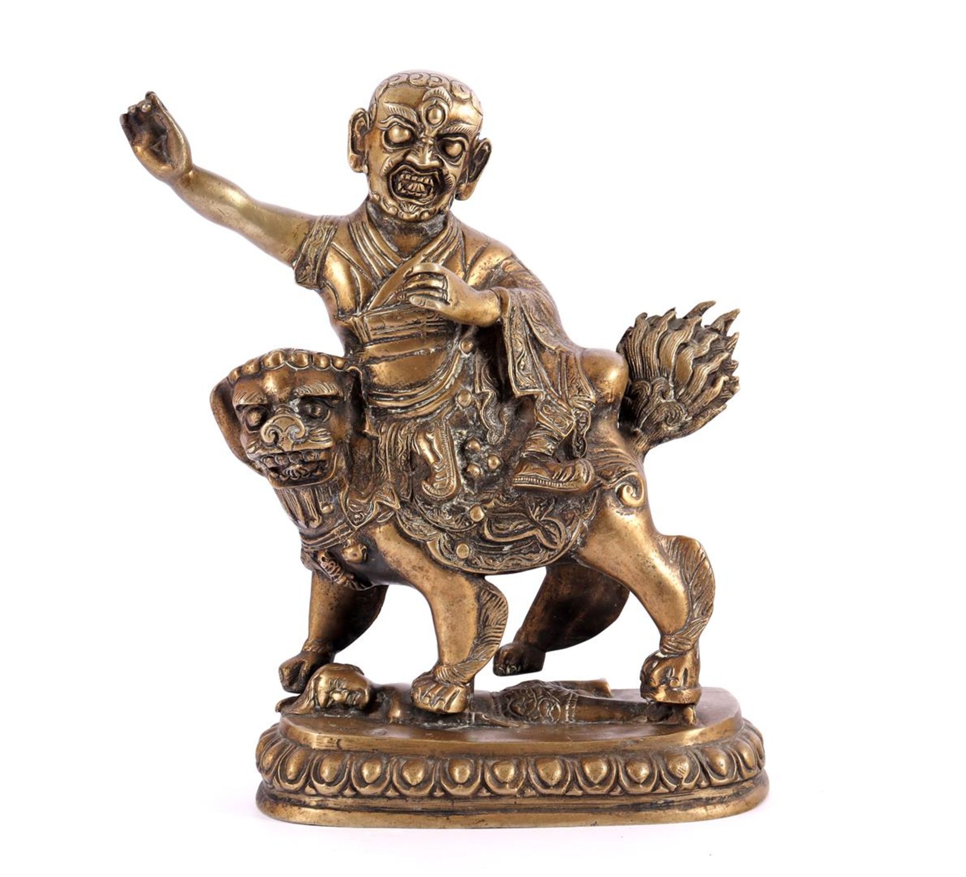 Asian bronze statue of a monk on a fantasy animal