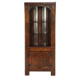 Oak corner cabinet with drum-shaped back