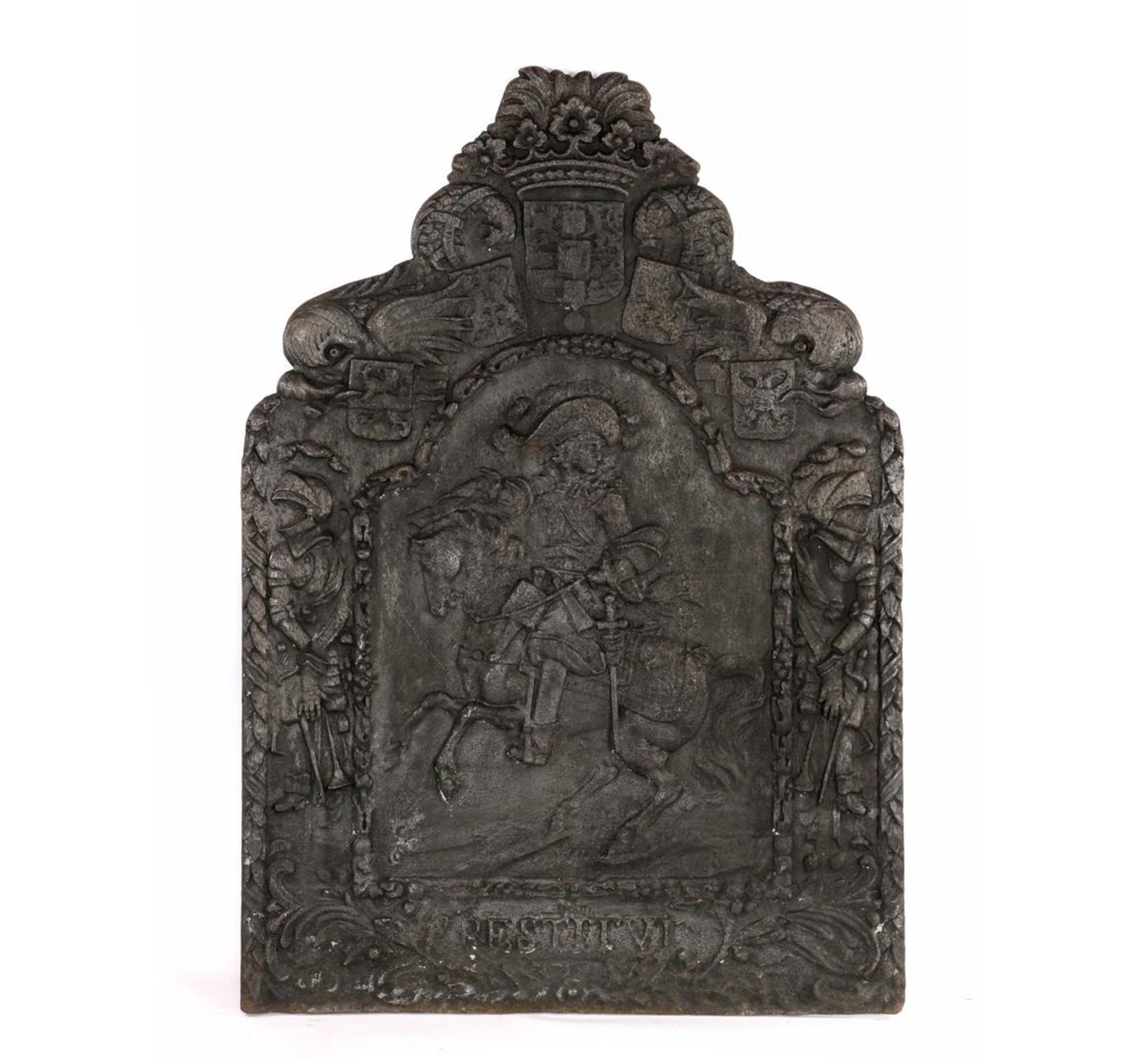 Antique fireback with a decoration of a rider