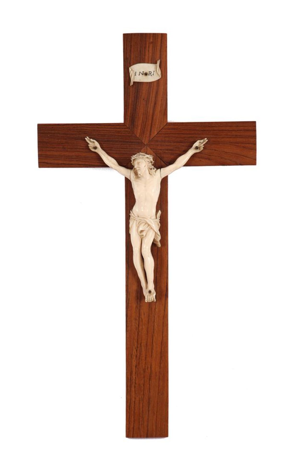 Richly carved ivory Corpus on wooden cross