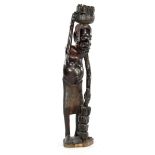 African blackened wooden bombarded statue