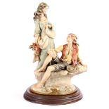 Porcelain statue of a romantic couple, signed Giuseppe Armani