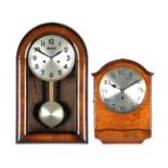 Kienzle regulator in walnut case and a regulator in walnut case