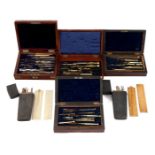 4 wooden boxes with various measuring and drawing tools