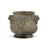 Metal pot with relief decoration and ears