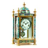 Brass table clock with enamel cloisonne and porcelain sides