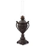 Metal richly worked table oil lamp