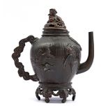 Bronze Asian teapot with richly carved decoration, 18 cm high