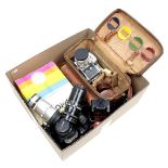 Box b.u. Polaroid E100 special camera, Exakta Varex II a, Canon T90 and various photo supplies