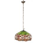 Glass tiffany hanging lamp surrounded by dragonflies