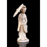 Carved ivory statue of a woman with a parasol, Japan, Meiji Period approx. 1890, 10.5 cm high, 54.4